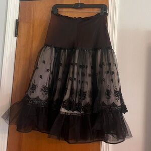 Vintage Penny Dale black skirt slip. Has a bow on front and elastic waist band.